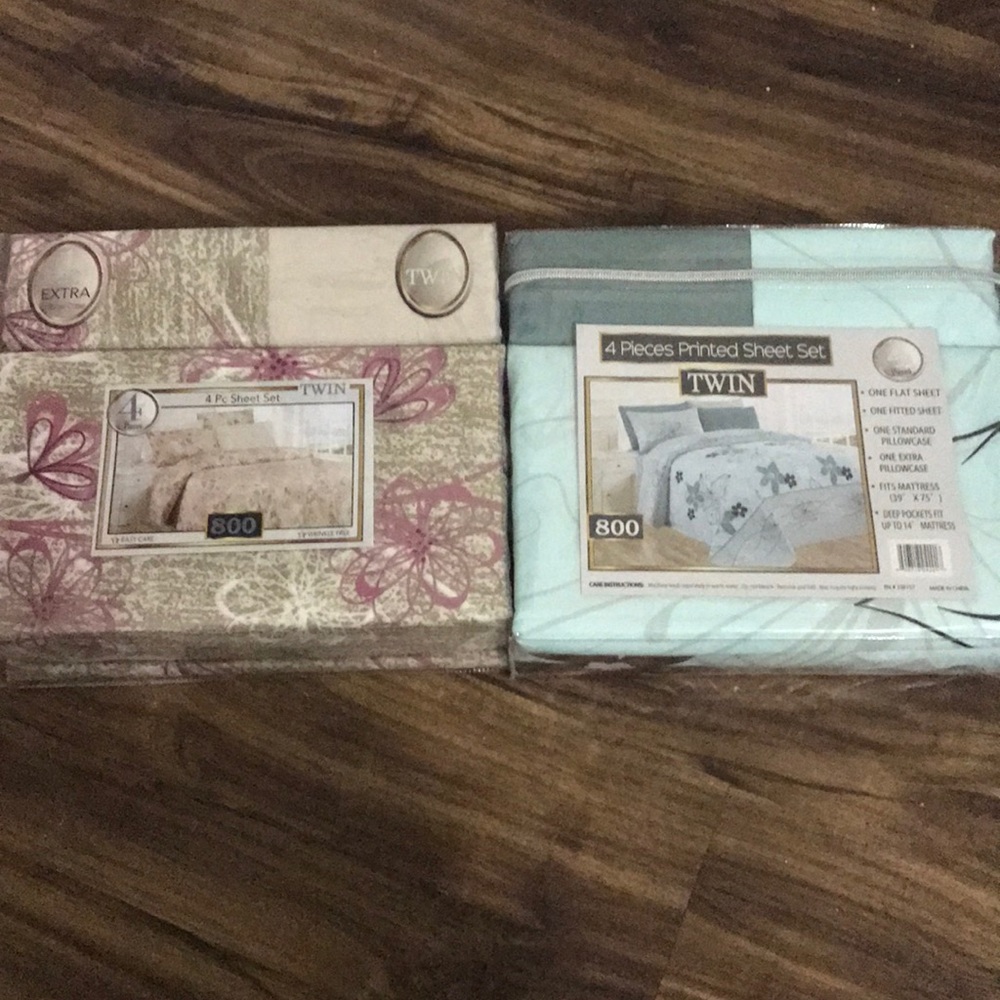 2 twin sheet sets NWT 4 pieces in each!! High end
